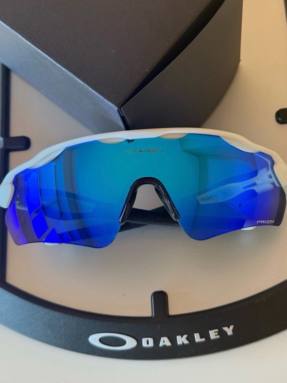 Oakley White Frame Sunglasses with Blue Mirrored Lens